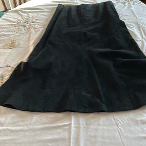 Long suede leather black skirt. Little swirl at the bottom fully lined. Nice!
